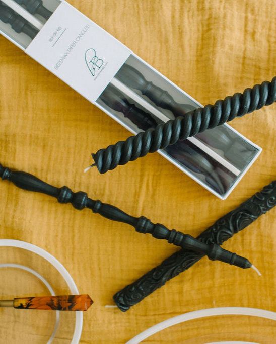 Charcoal black beeswax taper candles in Spindle, Helix and Flora patterns.  Exclusively designed by borrowed BLU